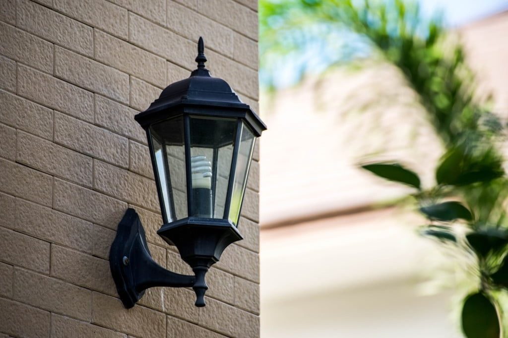 lantern mounted on outdoor wall