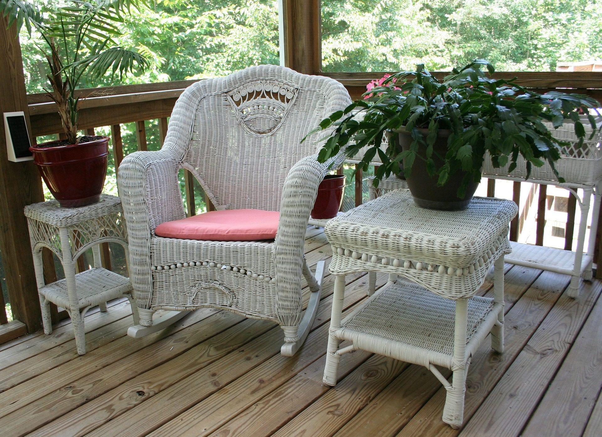 Wicker furniture set on a wooden deck