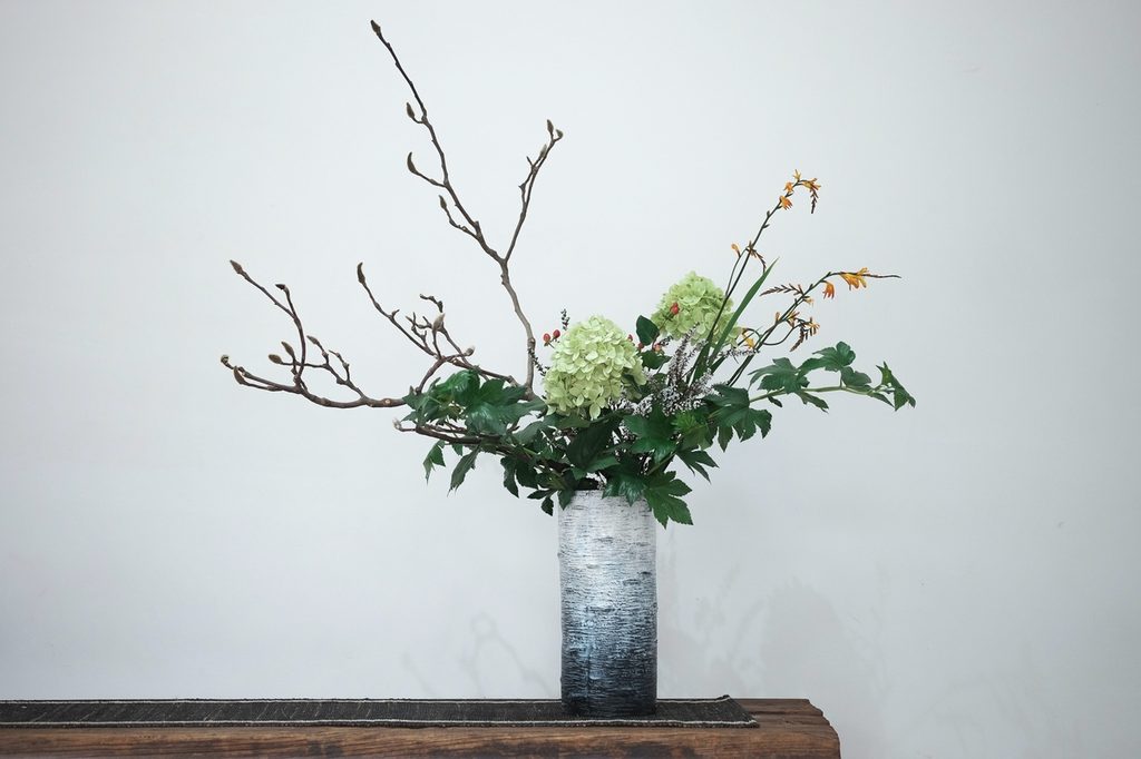 Flower arrangement in blue vase