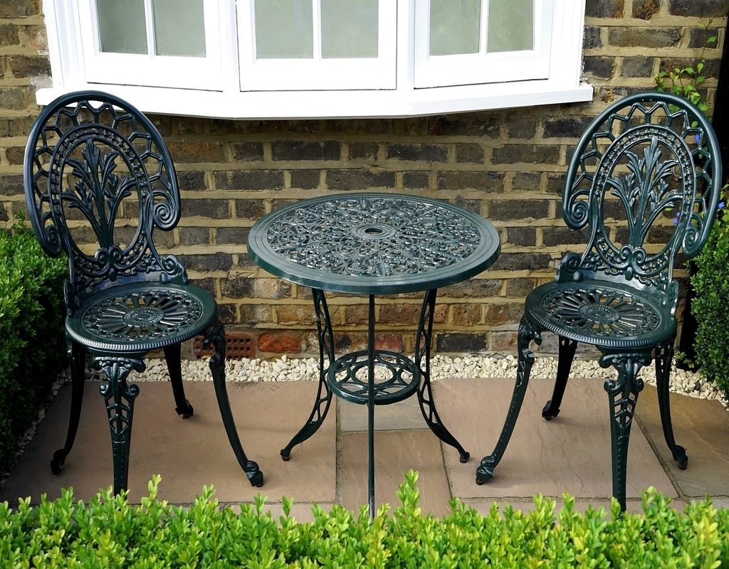 Metal furniture set on a stone patio