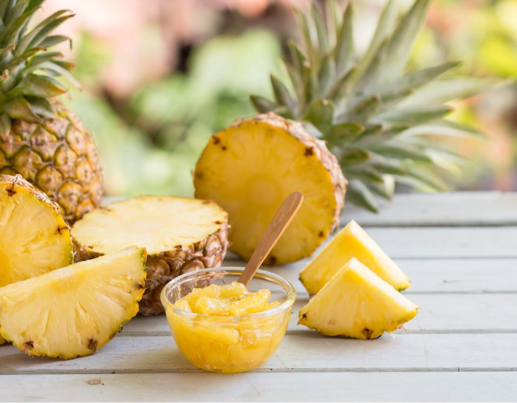 cut up pineapple on a table