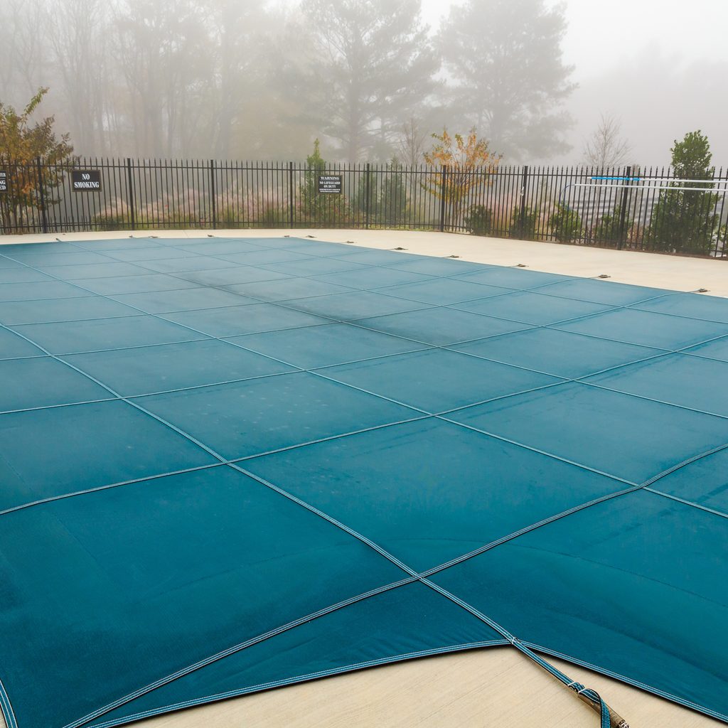 Mesh pool cover in fog