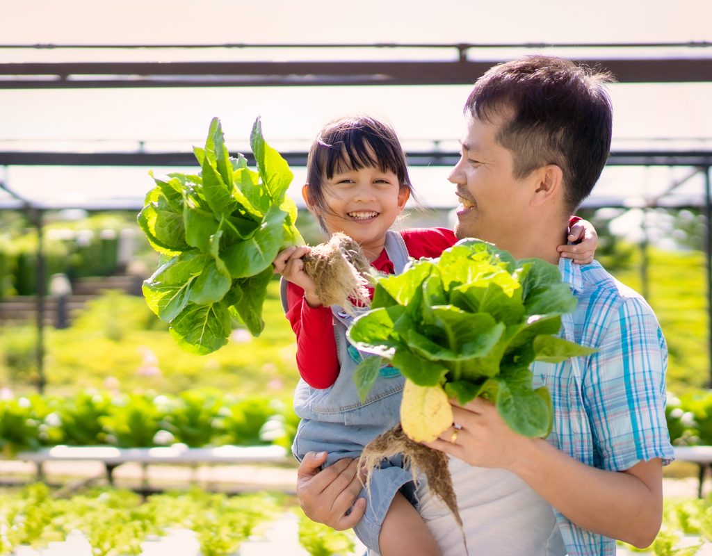 A father and daughter gardening