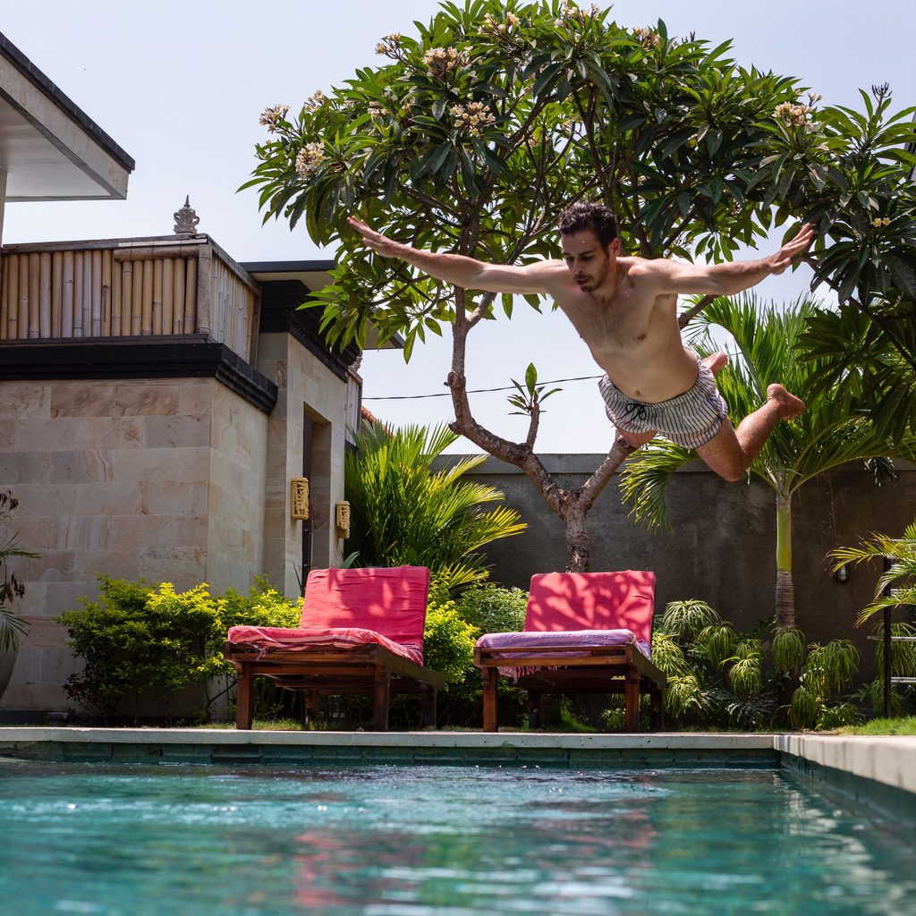Man Jumping Into Swimming Pool