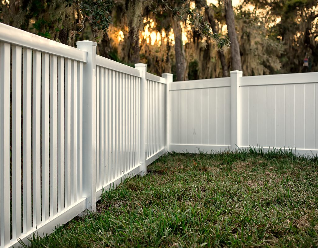White plastic fence around a patch of land