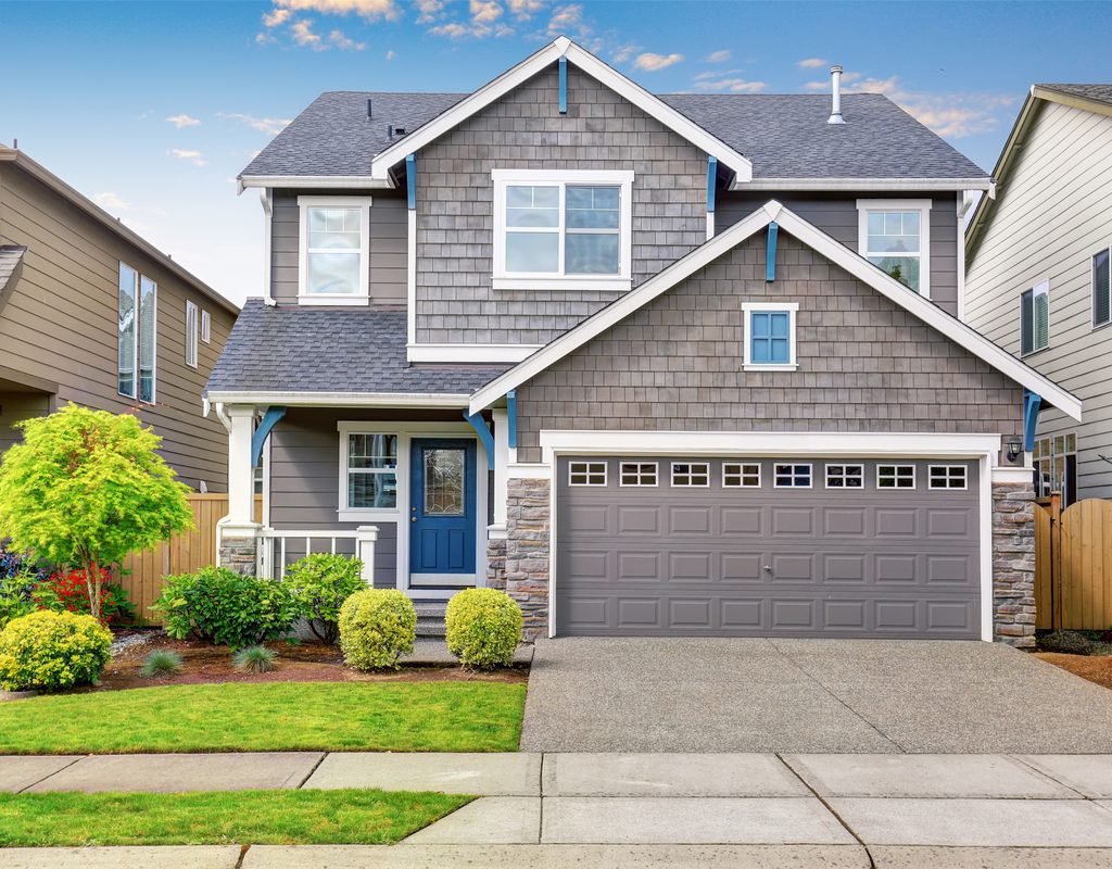 small front yard with a manicured landscape