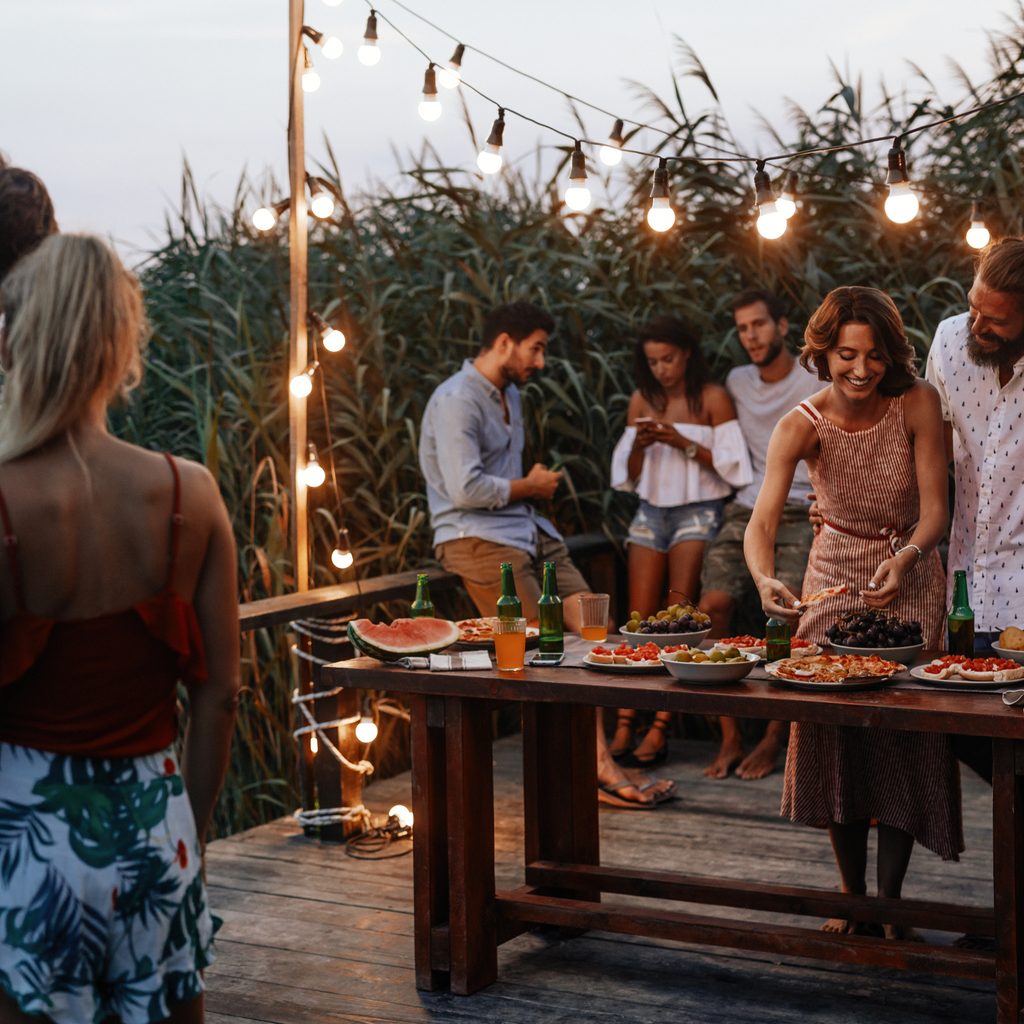 Group of young men and women at barbecue