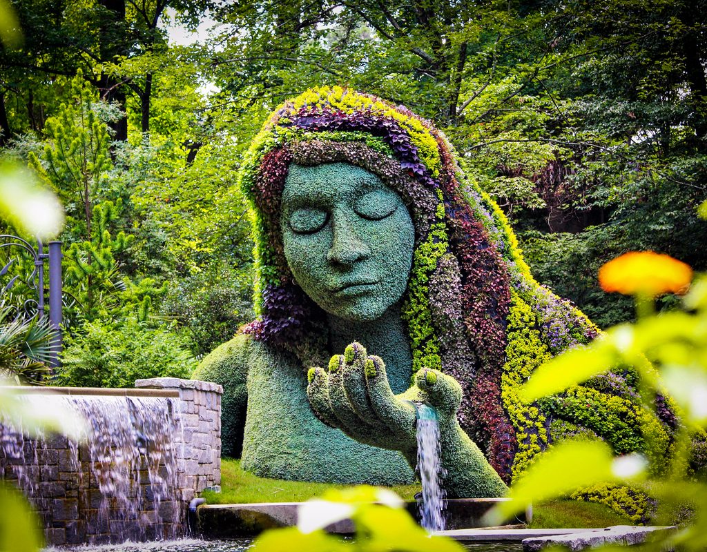 A large flower sculpture of a woman