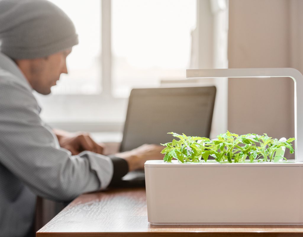 A man sitting with his smart garden
