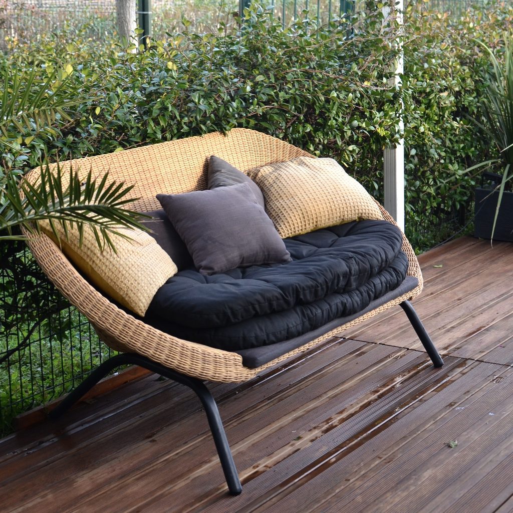 Outdoor sofa with black cushions