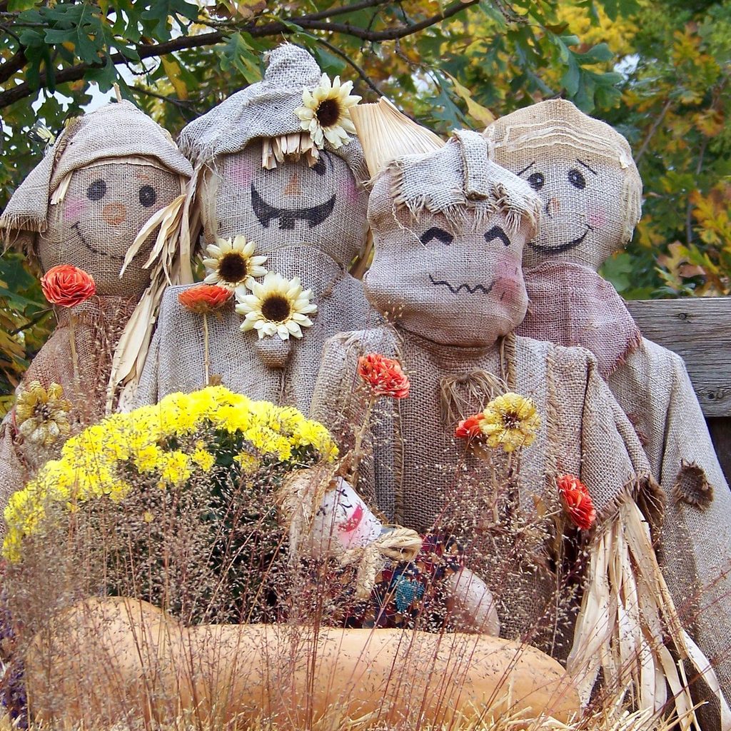 A family of scarecrows made from burlap