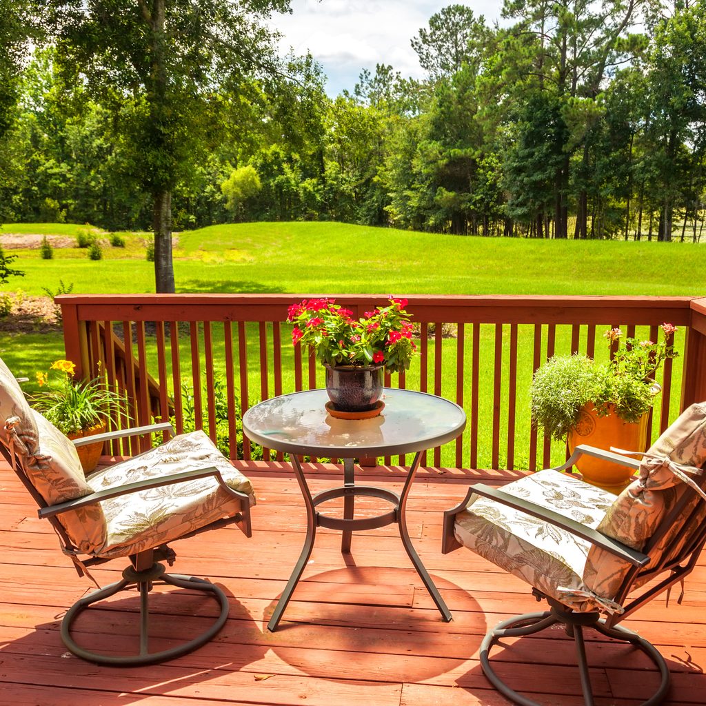 Wooden deck overlooking backyard