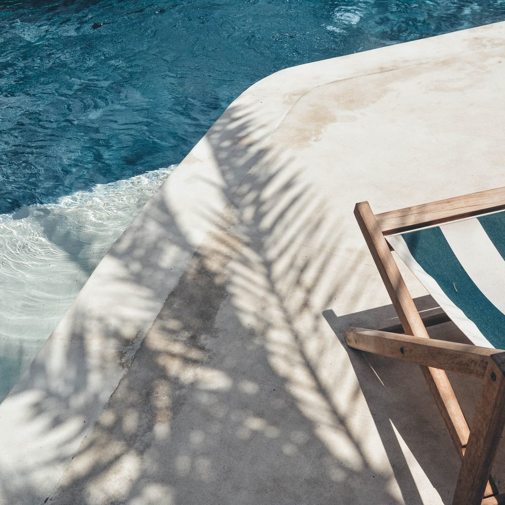 in ground pool with chair