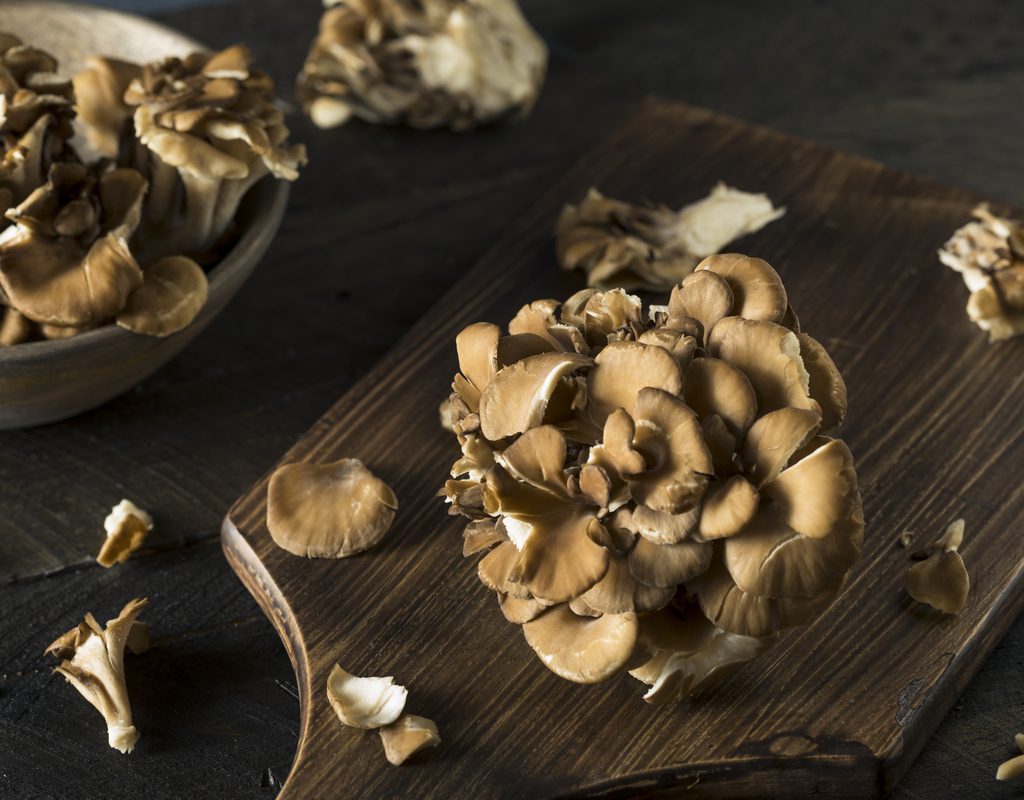 Maitake mushrooms on a cutting board