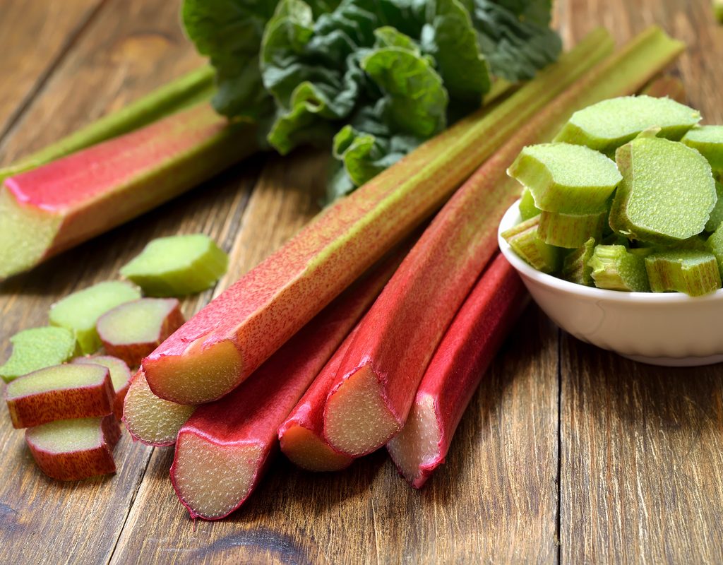 A cutting board with rhubarb on it