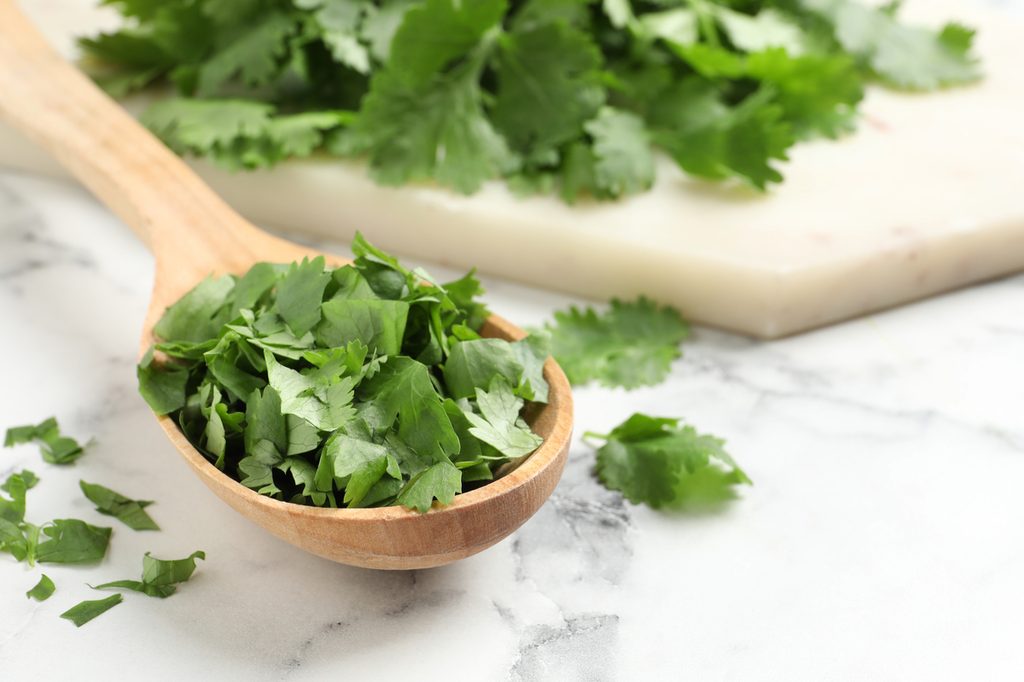 Fresh cilantro in a spoon