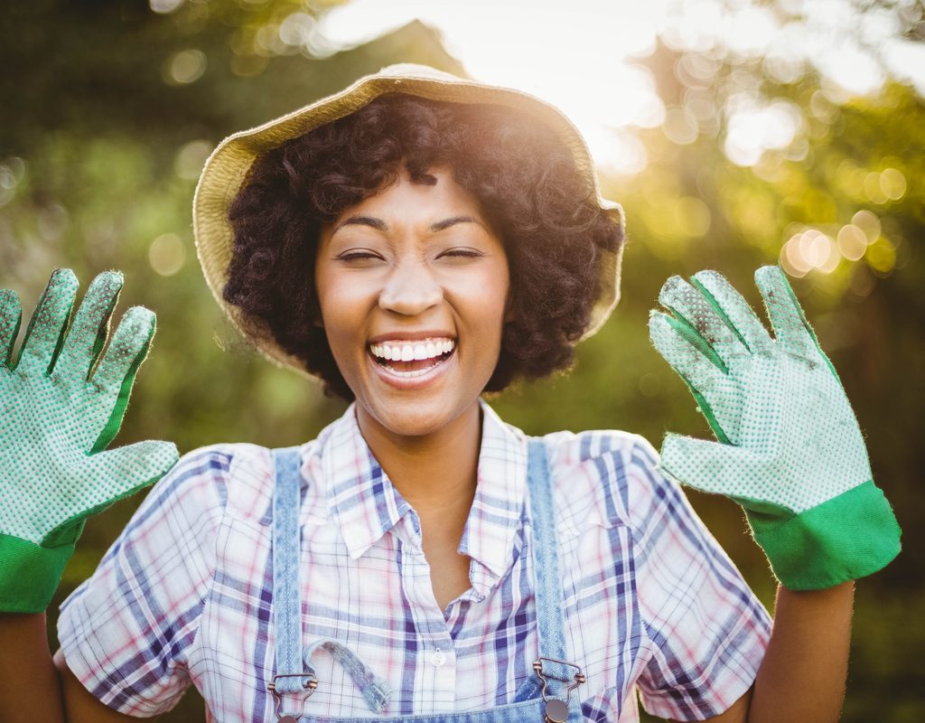 A happy gardener with gloves