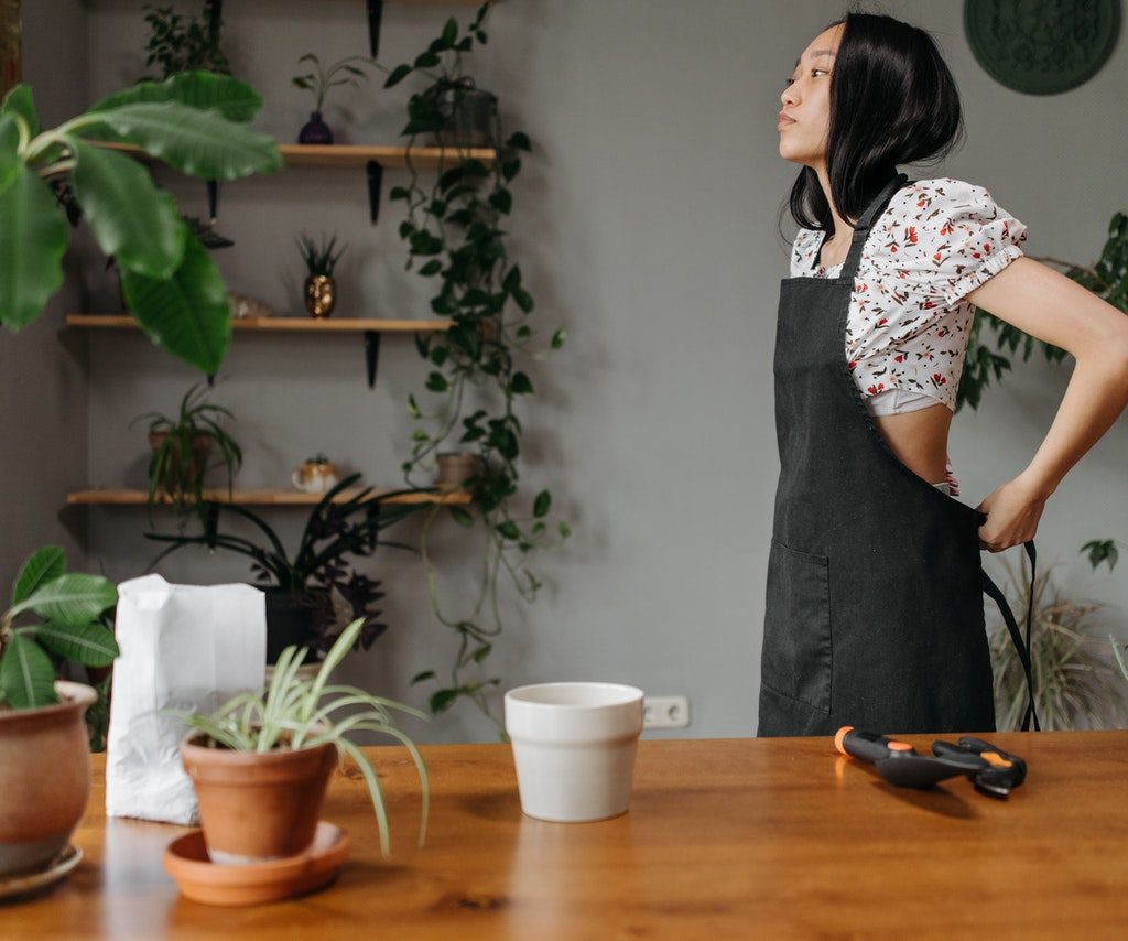 woman preparing to care for plants