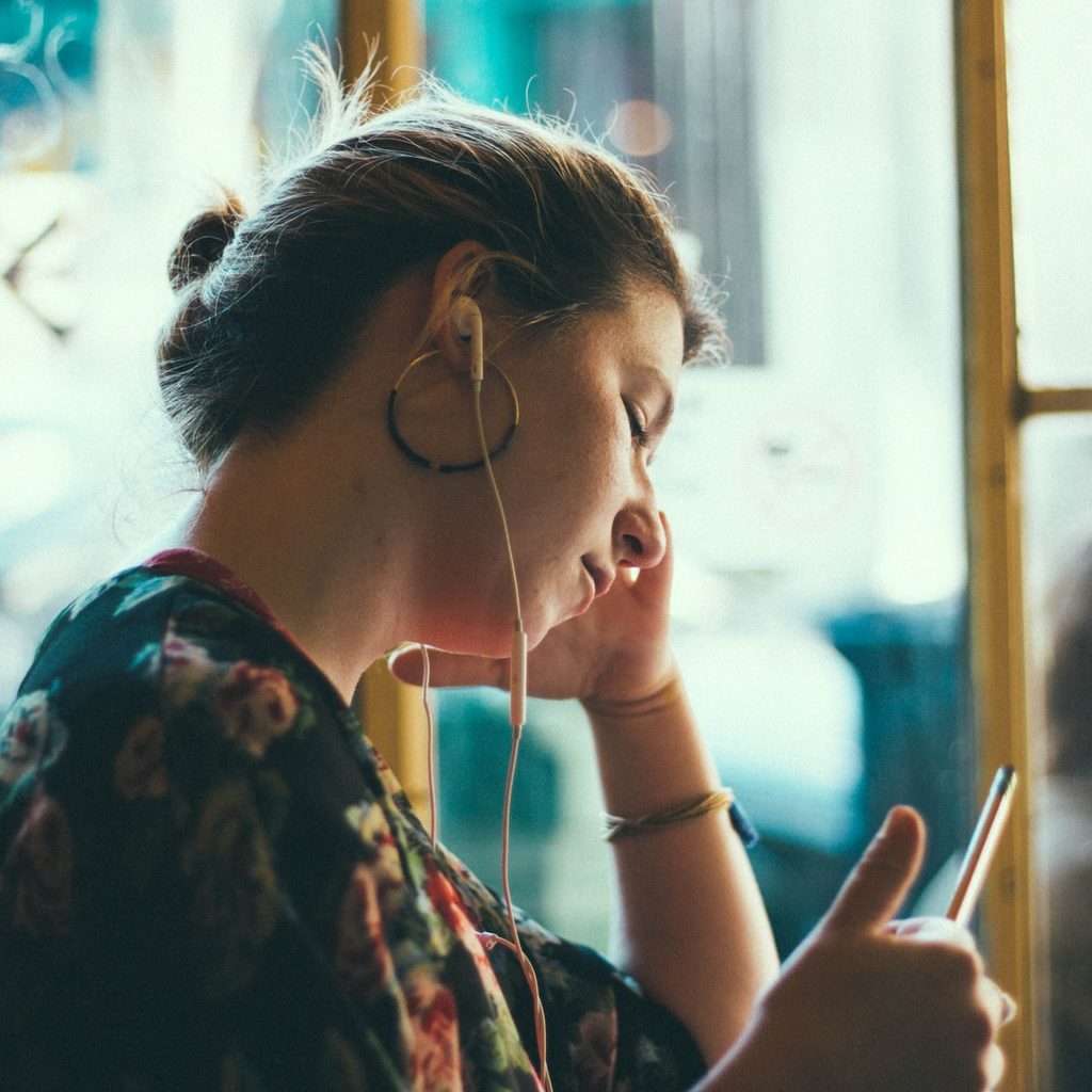 person listening with headphones