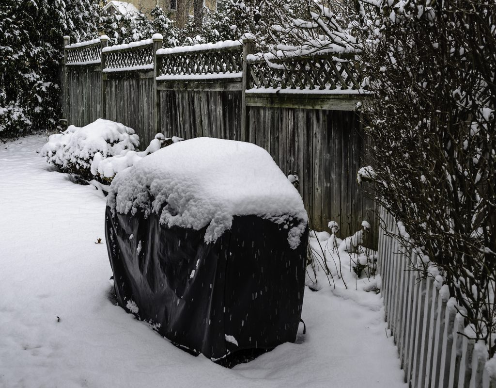 Winter grill covered in snow