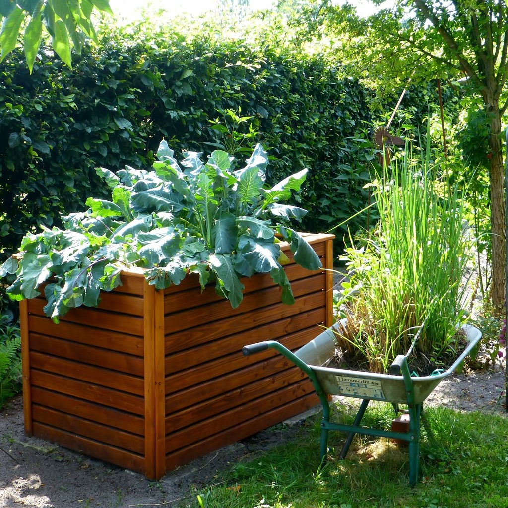 Raised garden bed with wheelbarrow
