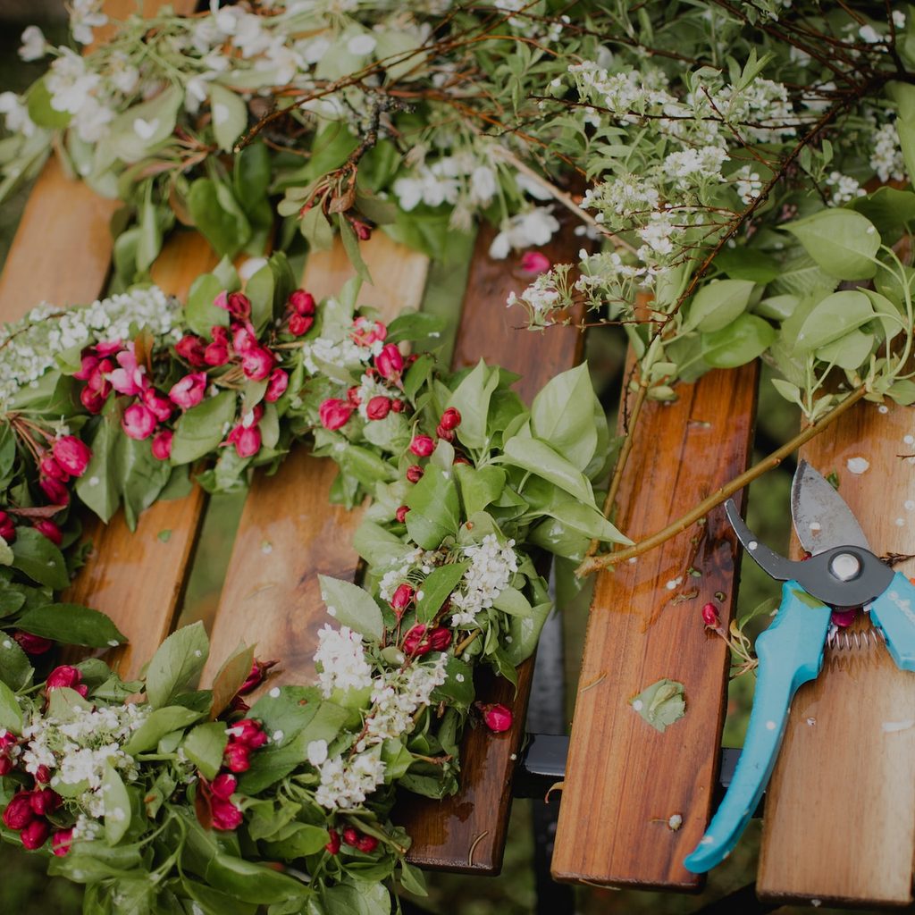 Flower wreath on wooden table