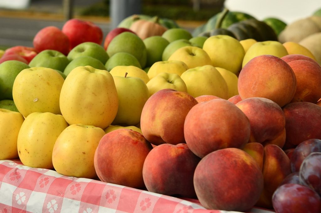 A farmers market stall selling fruit