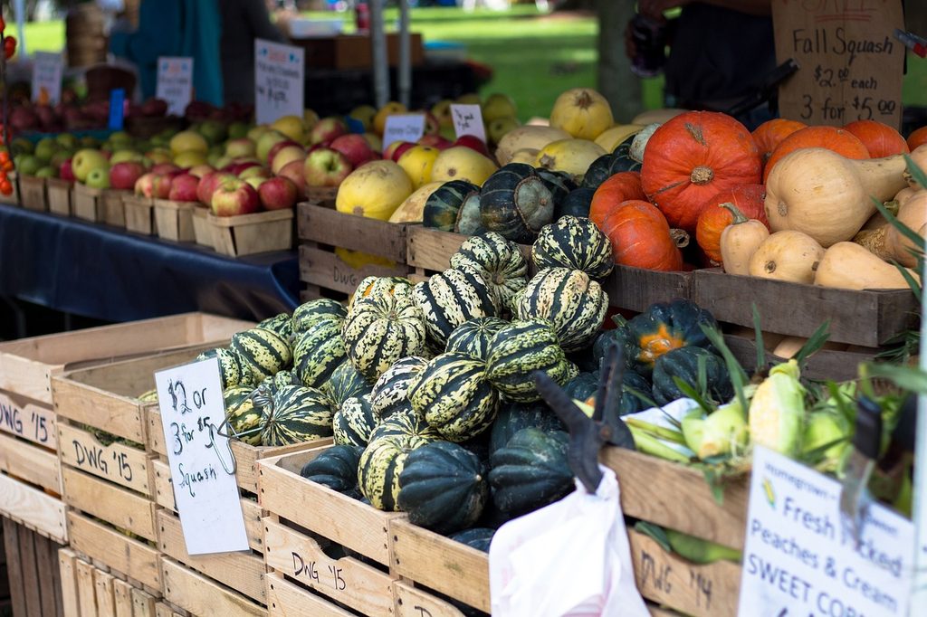A farmers market stall selling gourds
