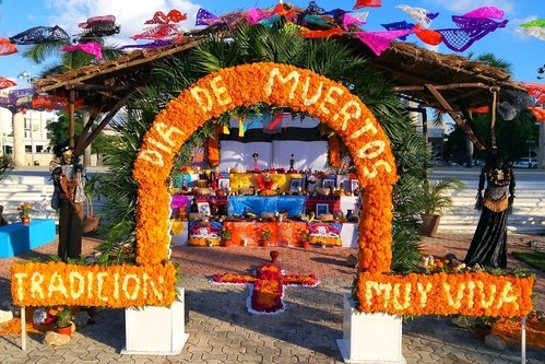 Dia de los muertos ofrenda with marigold archway