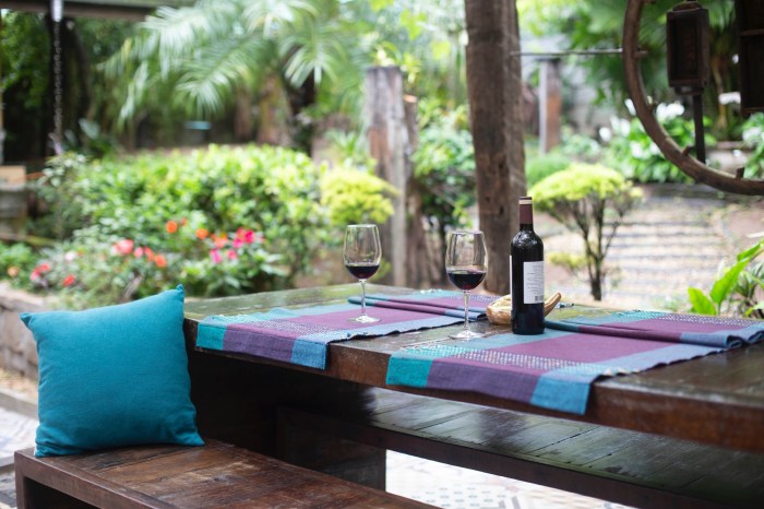 Wine bottle and glasses in an outdoor patio