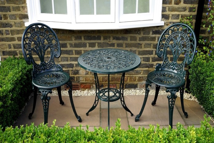 Metal furniture set on a stone patio