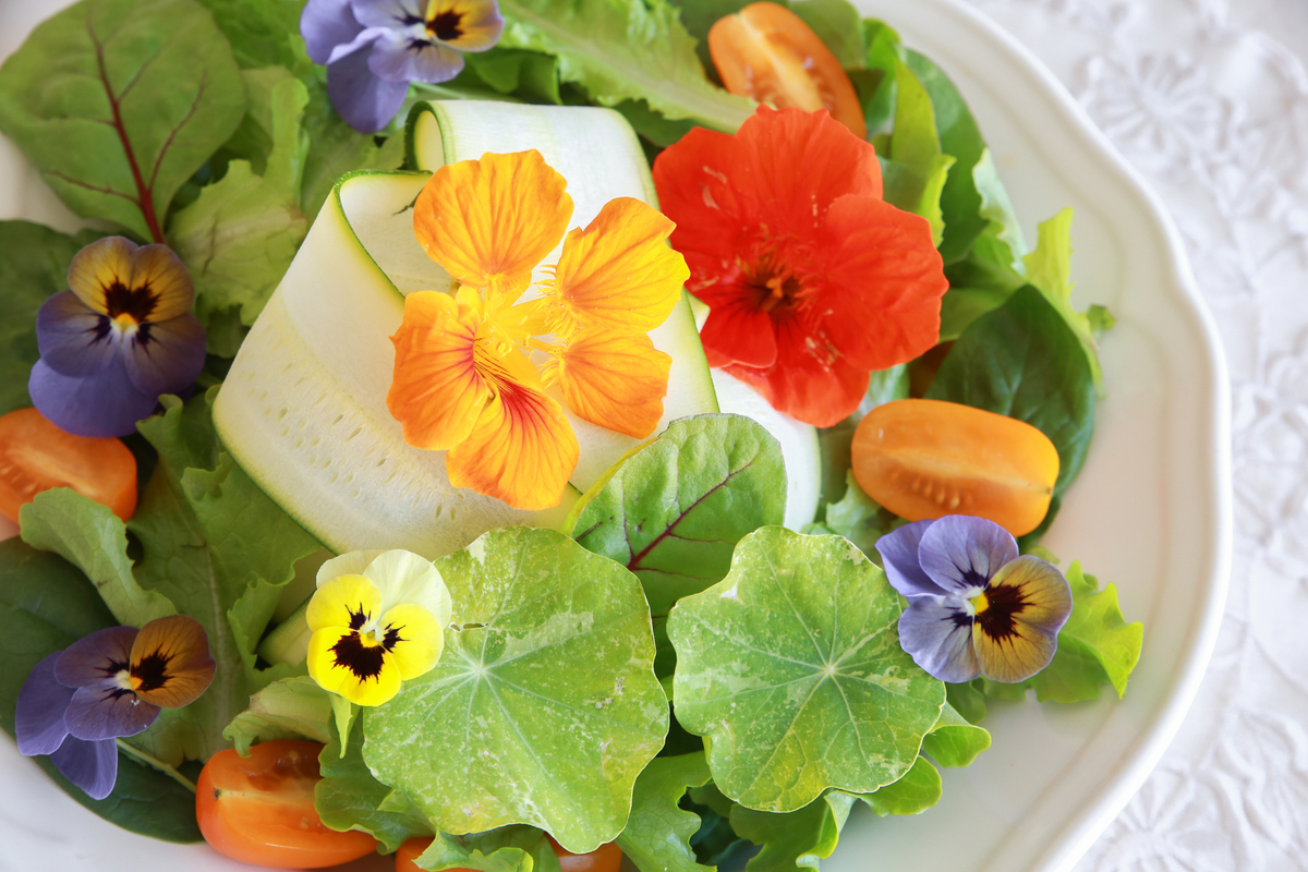 salad with nasturtium and pansy flowers