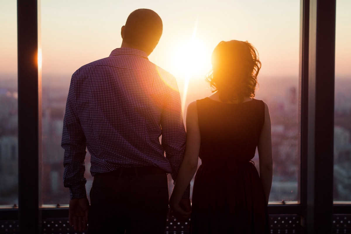 couple standing in sunlight