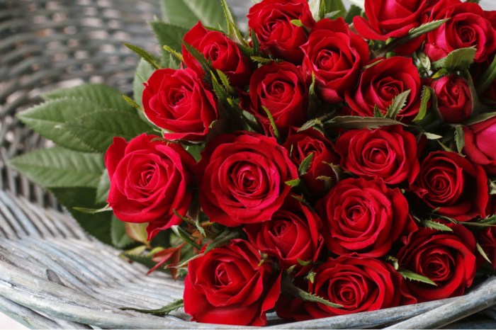 A beautiful red rose bouquet in a wicker basket