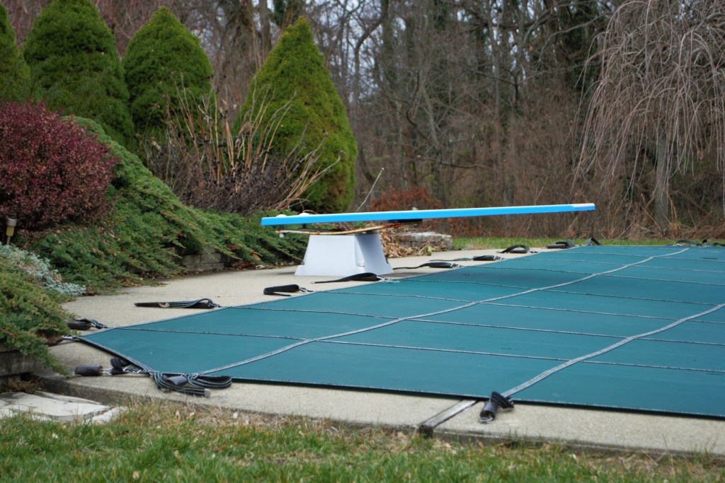 Backyard swimming pool with cover