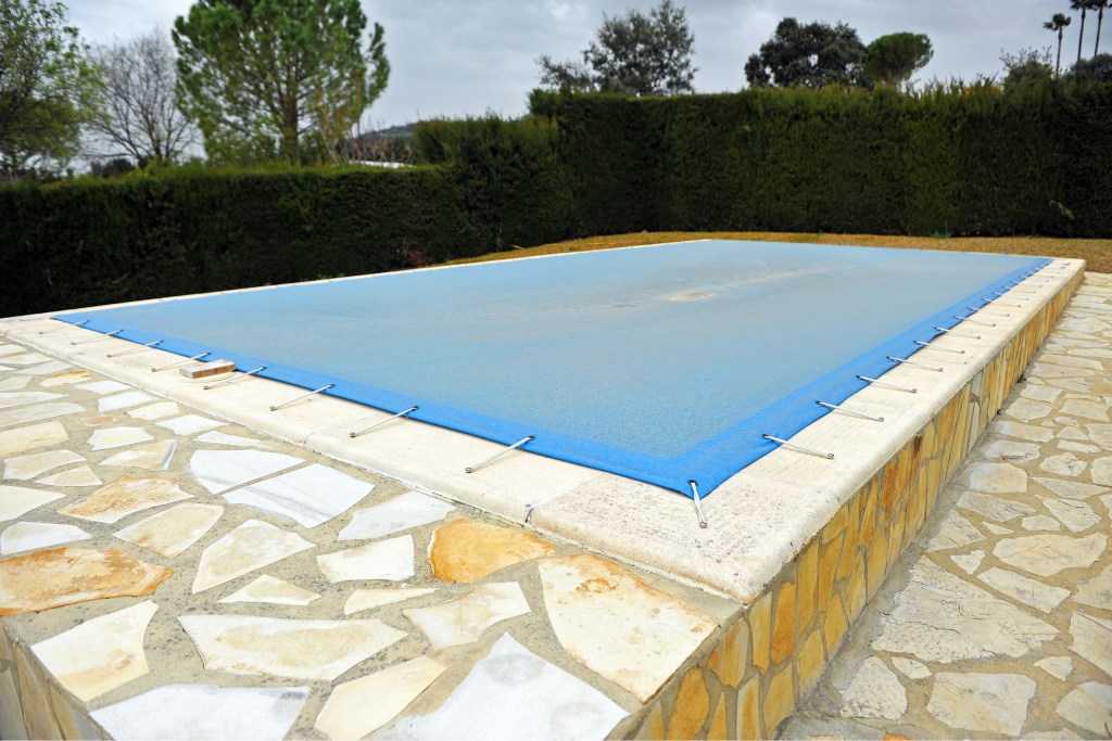 Pool Covered With Blue Pool Cover