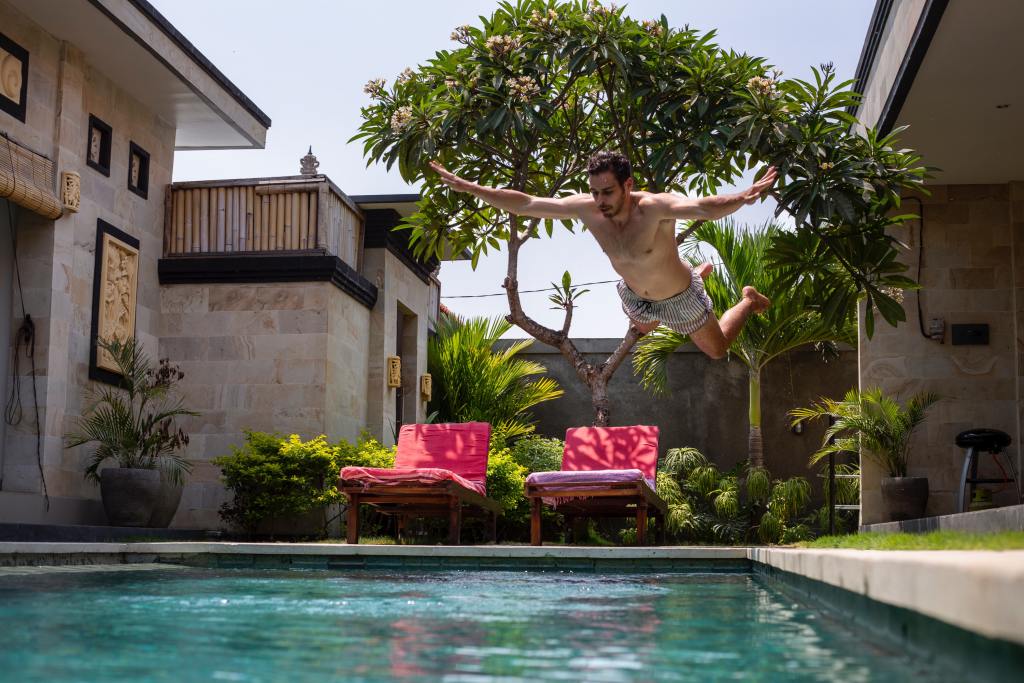 Man Jumping Into Swimming Pool