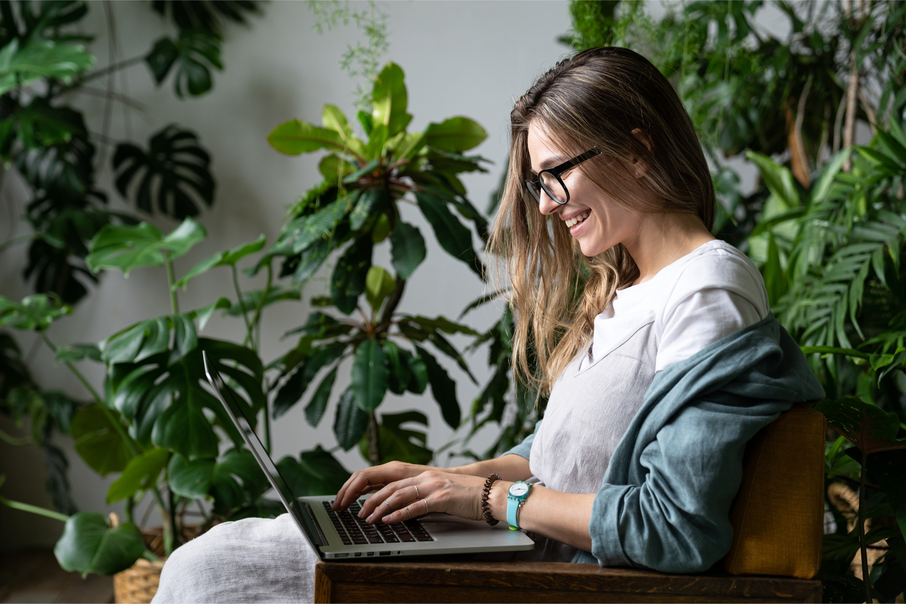 Person working on computer in garden