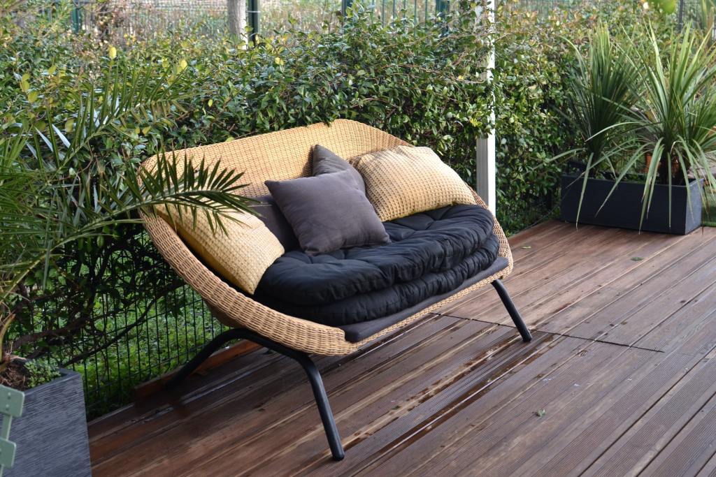Outdoor sofa with black cushions