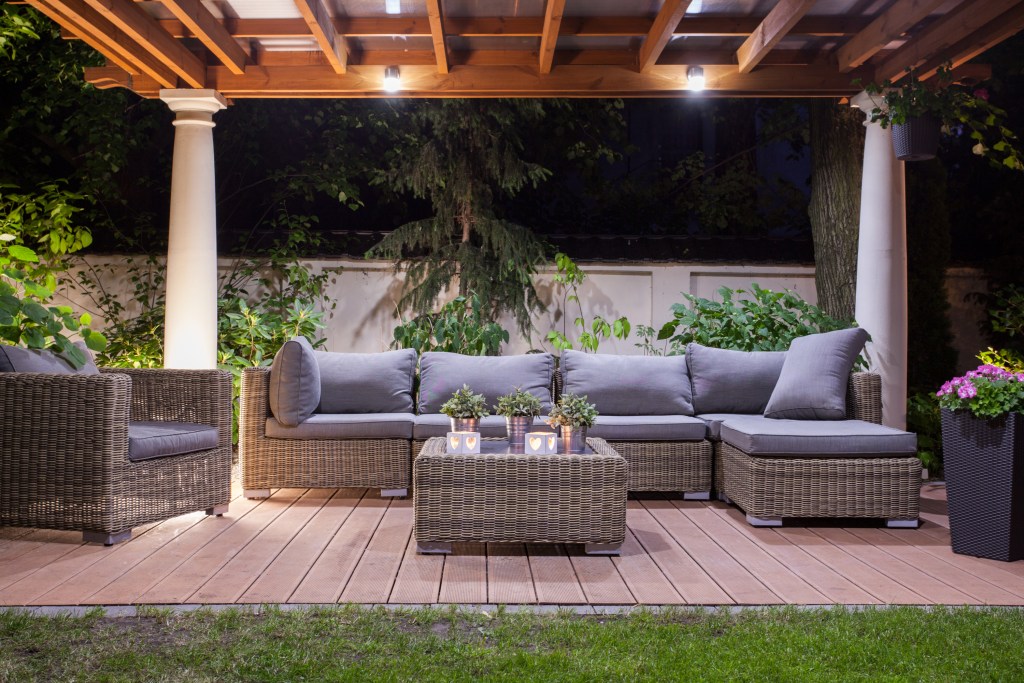 Outdoor furniture on patio at night
