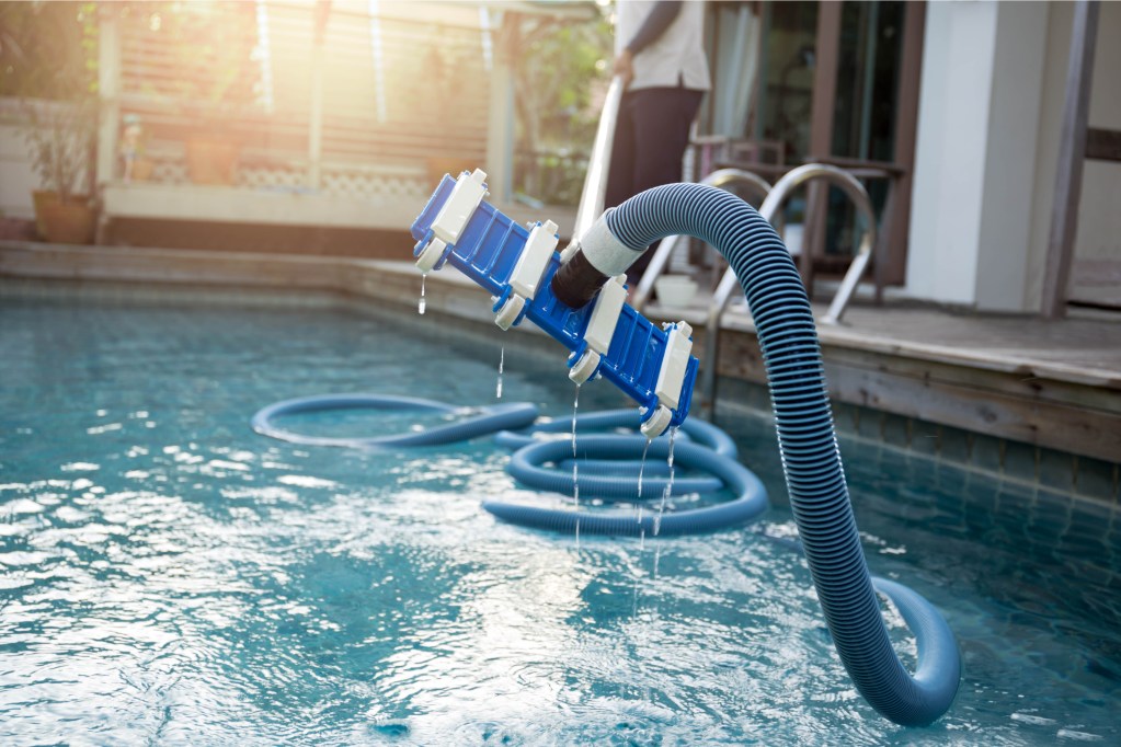 Man cleaning pool