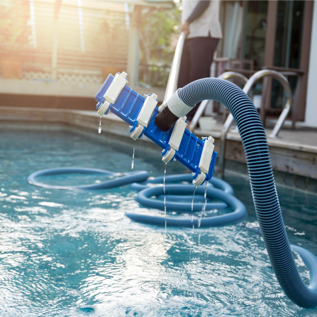 Man cleaning pool
