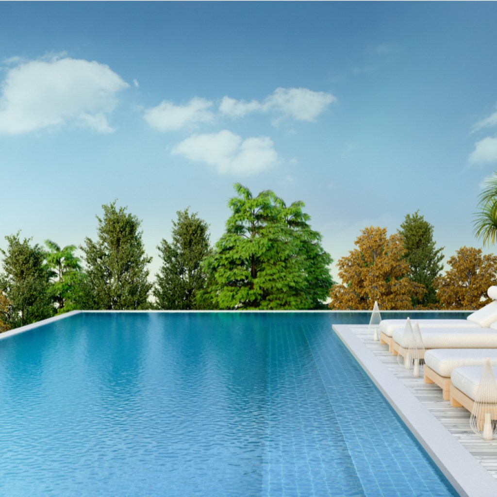 Lounge chairs set up next to a pool