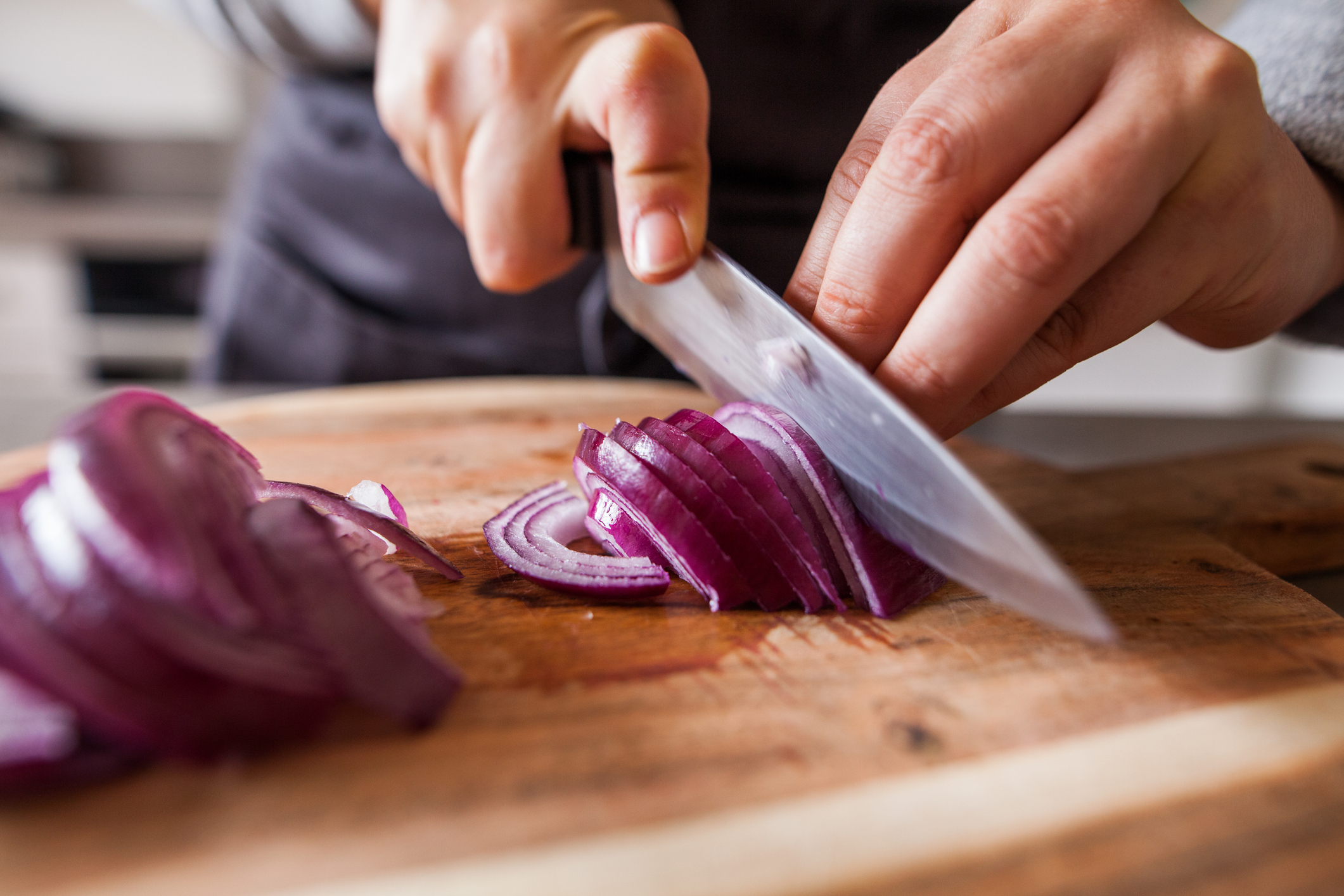 Chopping onion with knife