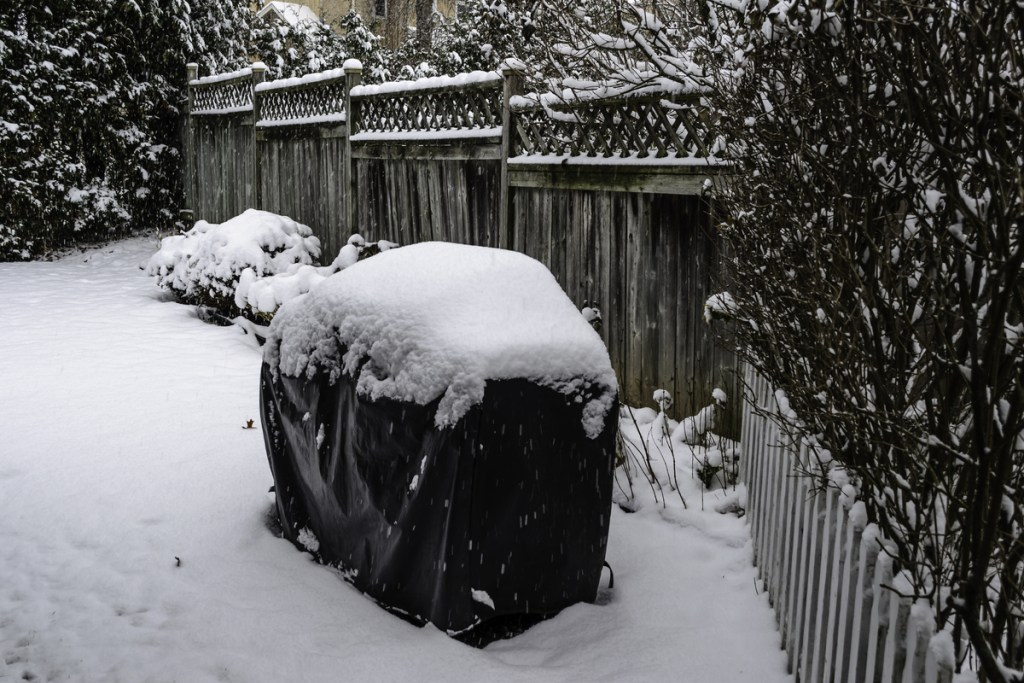 Winter grill covered in snow