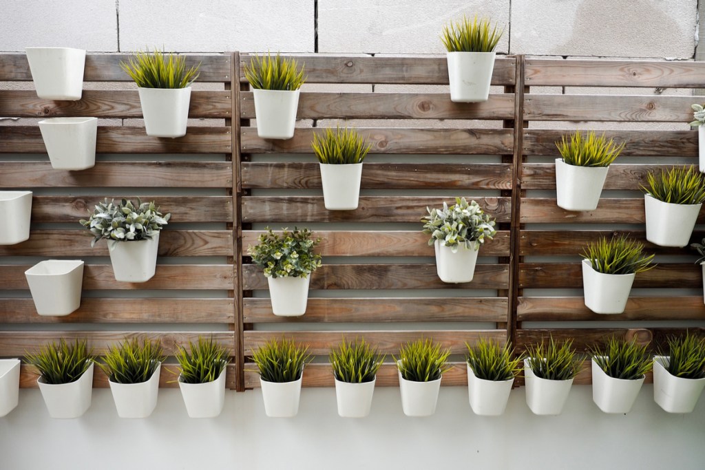 A wall-hanging garden made from a wooden pallet