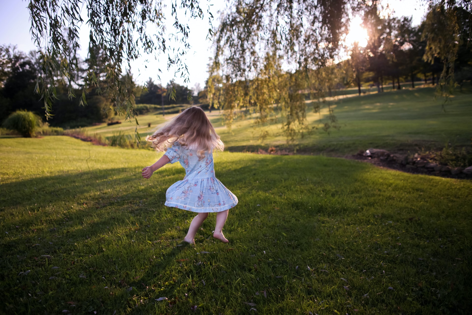 Child playing in grass