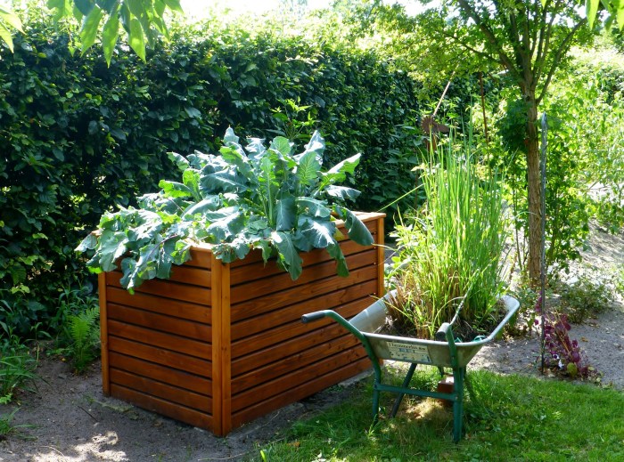 Raised garden bed with wheelbarrow