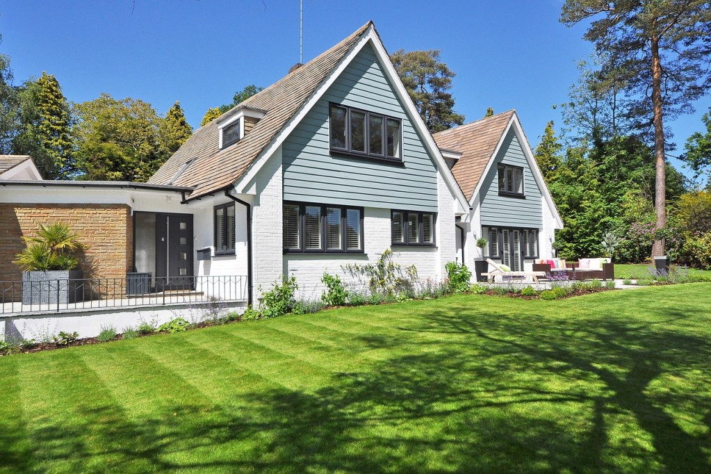 A home with a grass lawn