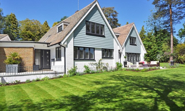 A home with a grass lawn
